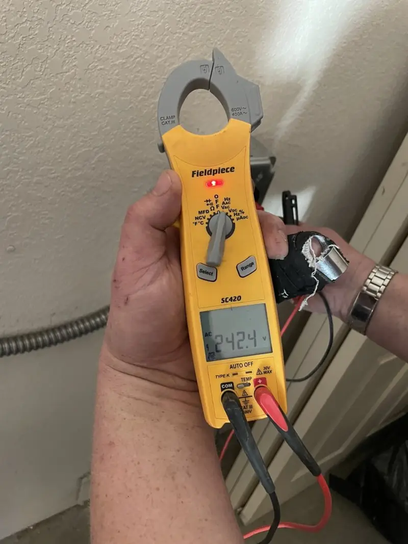 Voltage testing with clamp meter during Outlet Installation in Bordentown